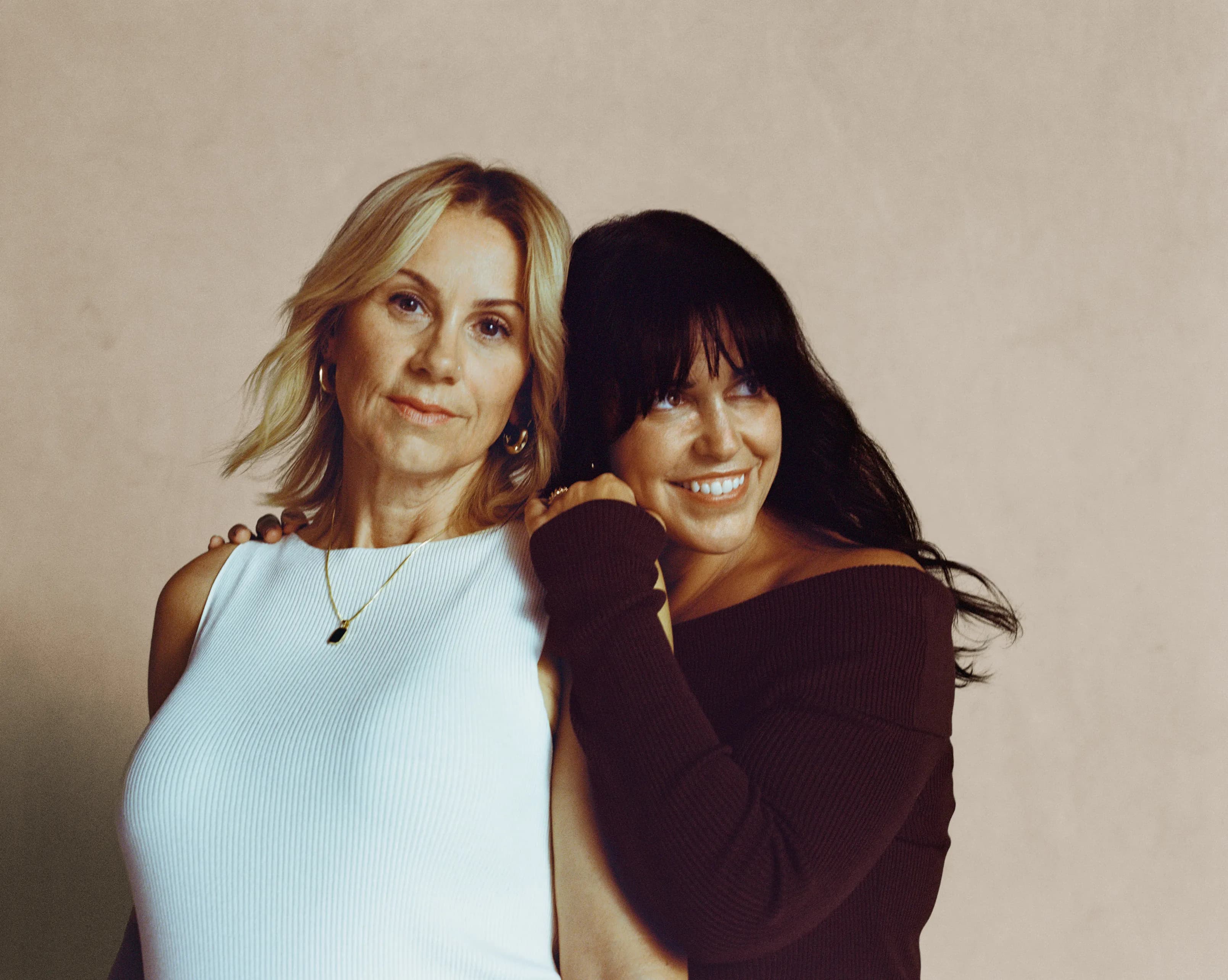 Two women sharing friendship and connection while navigating the menopause journey. Two women sharing friendship and connection while navigating the menopause journey.